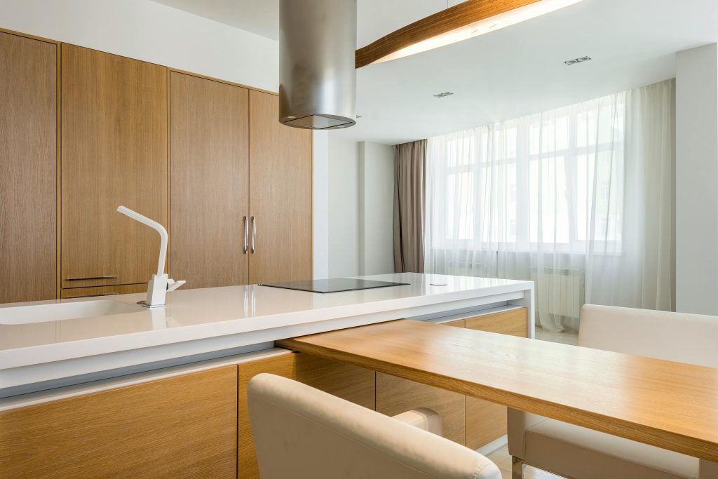 Spacious modern kitchen with wooden accents and natural light. Perfect for lifestyle inspiration.